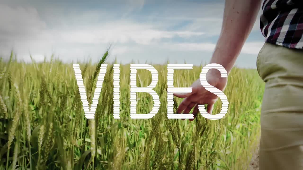 Animation of good vibes text over person walking of field