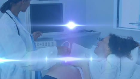 Animation-of-light-spots-over-happy-biracial-pregnant-woman-with-doctor