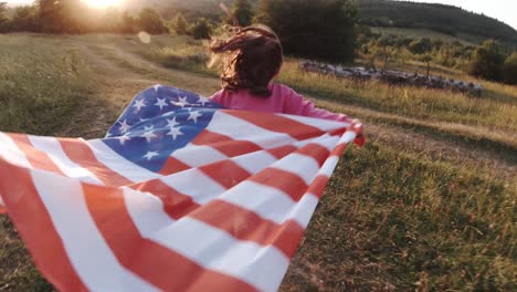 baby running with the usa flag and celebrating