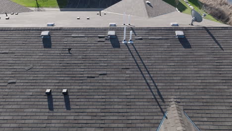 aerial, gray roof tiles on a suburb townhouse home during the day