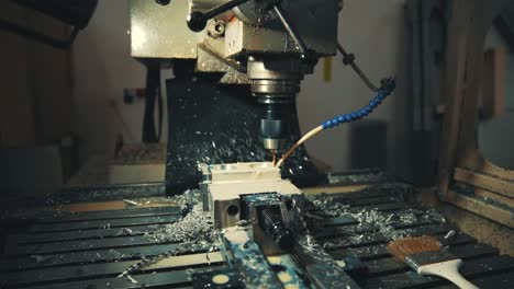 Drilling-metal-plates-with-the-help-of-a-drill-and-water-4K