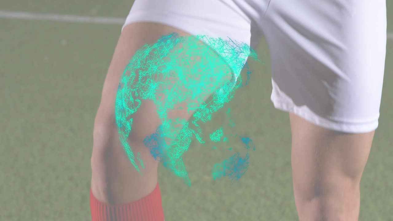 Tecnologia che mostra un giocatore di calcio che incrocia le braccia con un ologramma della porta che appare sulla coscia e sale fino alla maglia