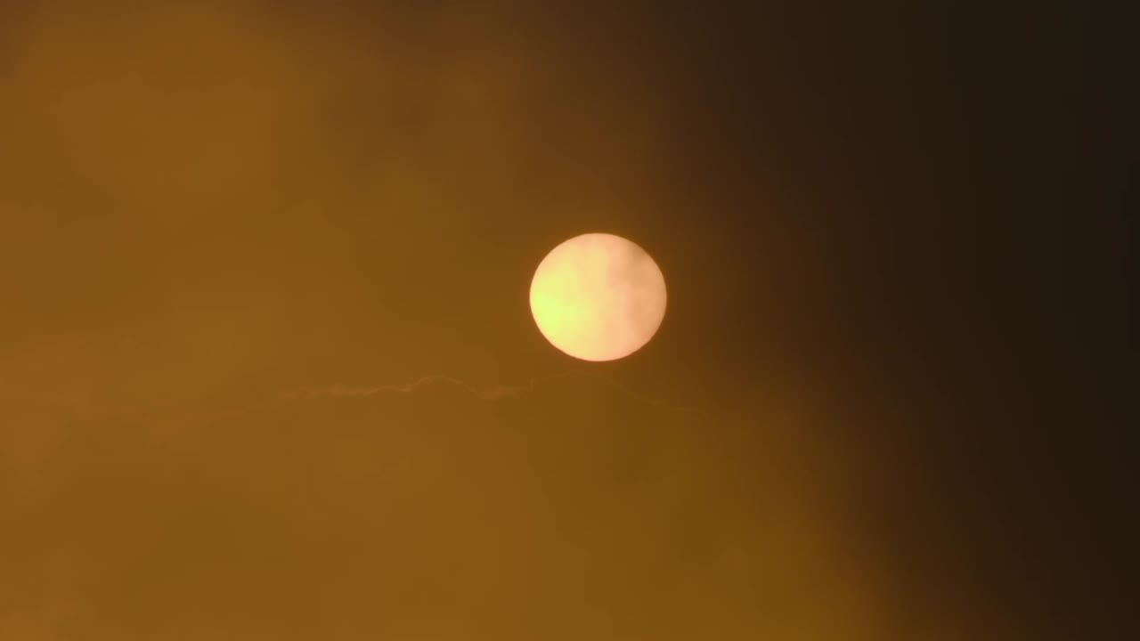 Sunrise/Sunset through Hazy Clouds