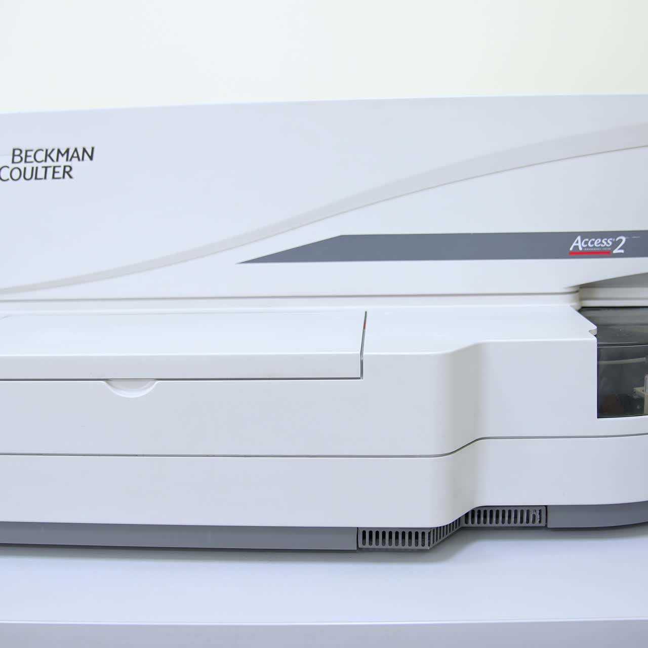 Female hand in the blue latex gloves closing the lid at apparatus. Scientist working in the blood test laboratory in modern clinics