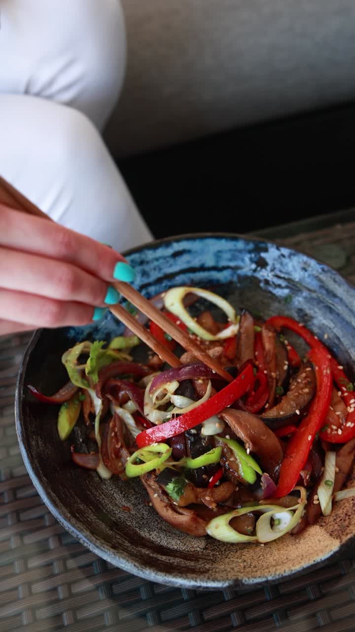 Woman Eating Delicious Stir-fried Vegetables