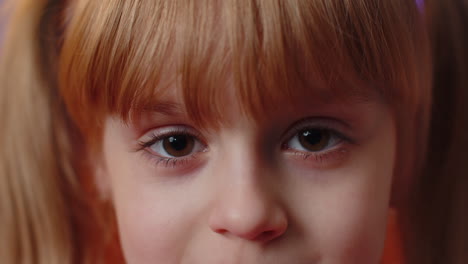 closeup portrait of a young girl with brown eyes.