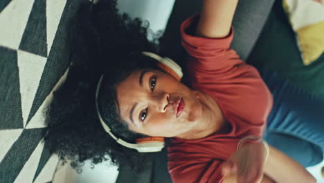 Music,-headphones-and-black-woman-dance-on-a-sofa