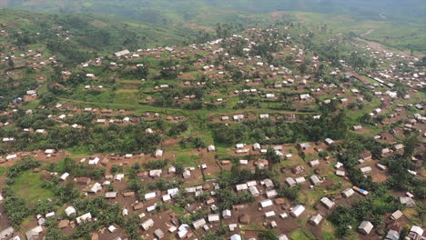 aerial flyover: hilly congolese jungle towns use every available space