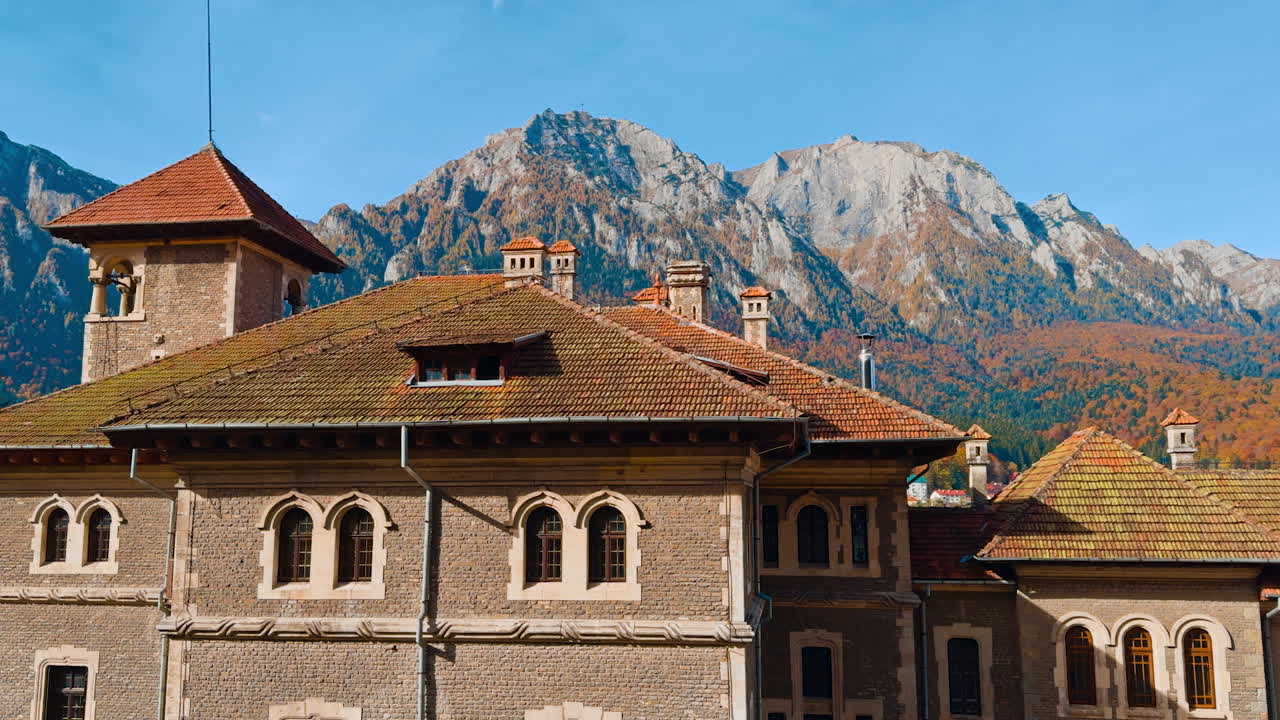 Old palace built in the gorgeous mountains. Sunny day in the autumn mountains.
