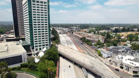 aerial static view, cars driving down 134 freeway in burbank, disney abc building