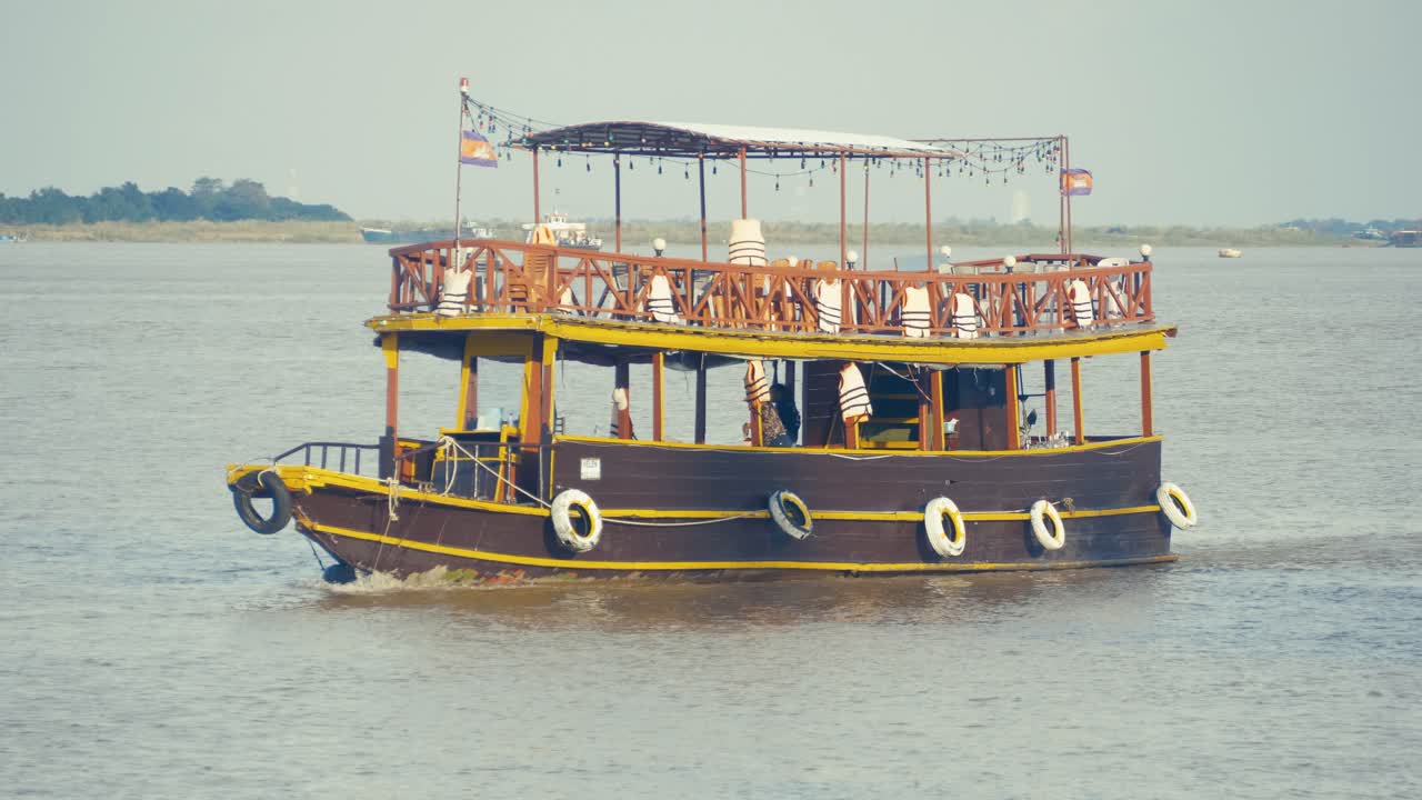 Tourist boat sail on Tonle river in Phnom Penh Cambodia Southeast Asia