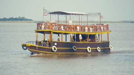 tourist boat sail on tonle river in phnom penh cambodia southeast asia