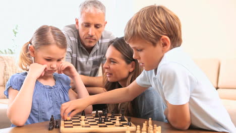 siblings playing chess