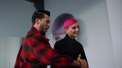 dancers posing for camera in modern class. dance couple dancing in studio.