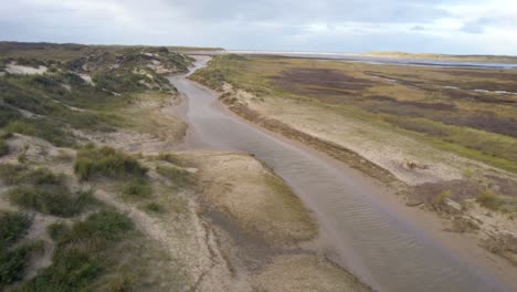 drone fly above river in texel wadden sea island mudflats,the netherlands