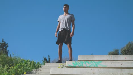 Black-athlete-warming-up-on-top-of-steps