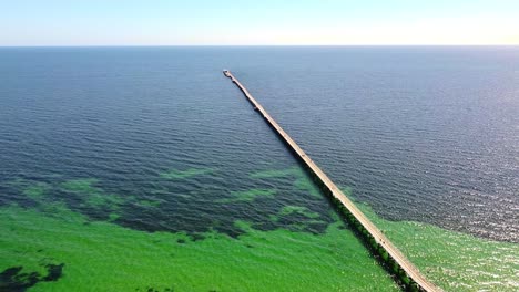 High-aerial-view-with-Busselton-Jetty-stretching-toward-the-horizon---Western-Australia