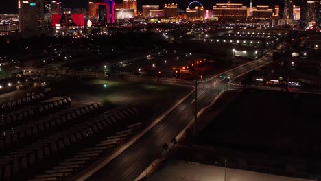 aerial close-up and tilting up shot of the central las vegas strip at night