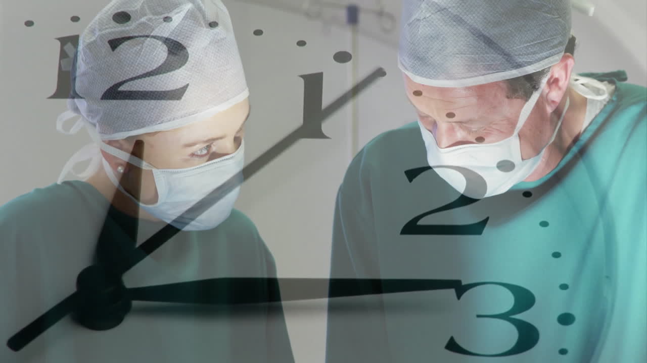Animation of clock hands ticking over caucasian male and female surgeon operating