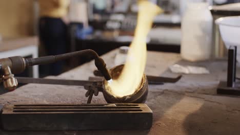 Close-up-of-melting-metal-with-blowtorch-in-workshop-in-slow-motion