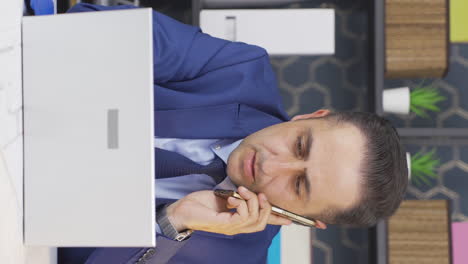 Vertical-video-of-Busy-businessman-working-hard.