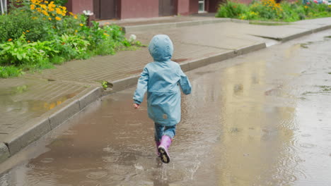 carefree child dashes across puddles healthy kid embraces playground of rainsoaked pavements with