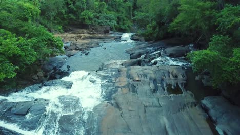 relaxing slow aerial shot of river and waterfall in brazilian rainforest