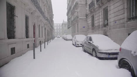 road covered with snow during a snowy day in montpellier france. car driving