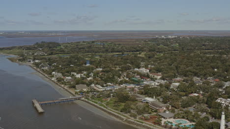 St-Simons-Georgia-Aerial-v13-dolly-out-shot-of-landscape,-town-and-Atlantic-Ocean---March-2020