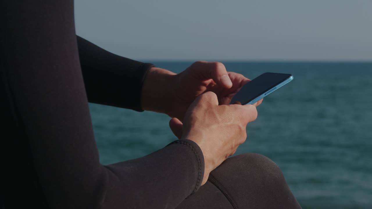 Surfer man walking to the beach at sunset preparing for surfing training and search for waves in Barcelona, spain, water, ocean exercise in sea with board, athletic male holiday or travel in vacation
