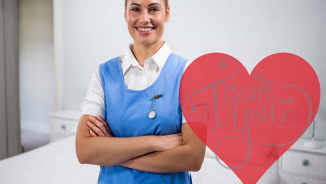 animation of thank you text in heart over female doctor smiling