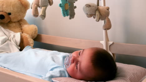 baby boy sleeping in crib