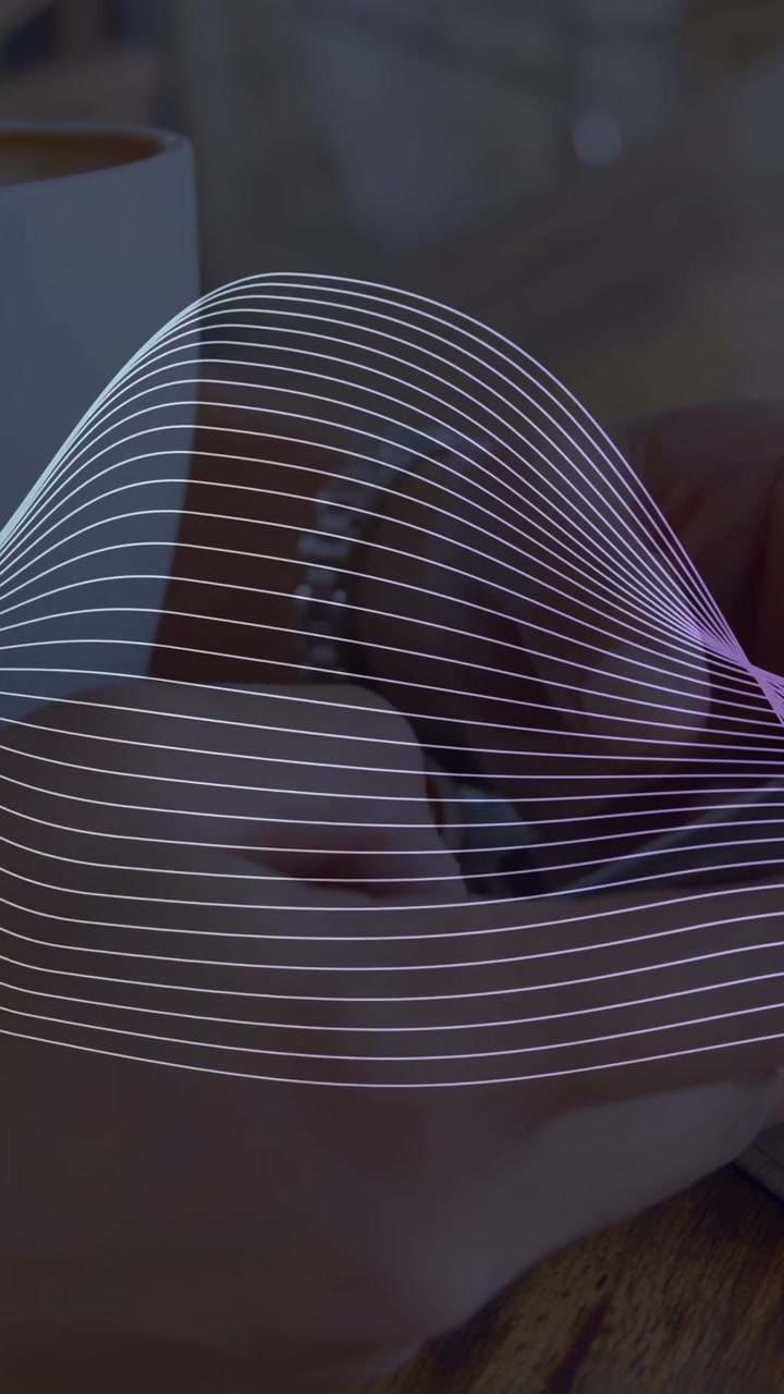 Vertical video: Woman shifting phone on table as wave overlay sweeping revealing watch for tech