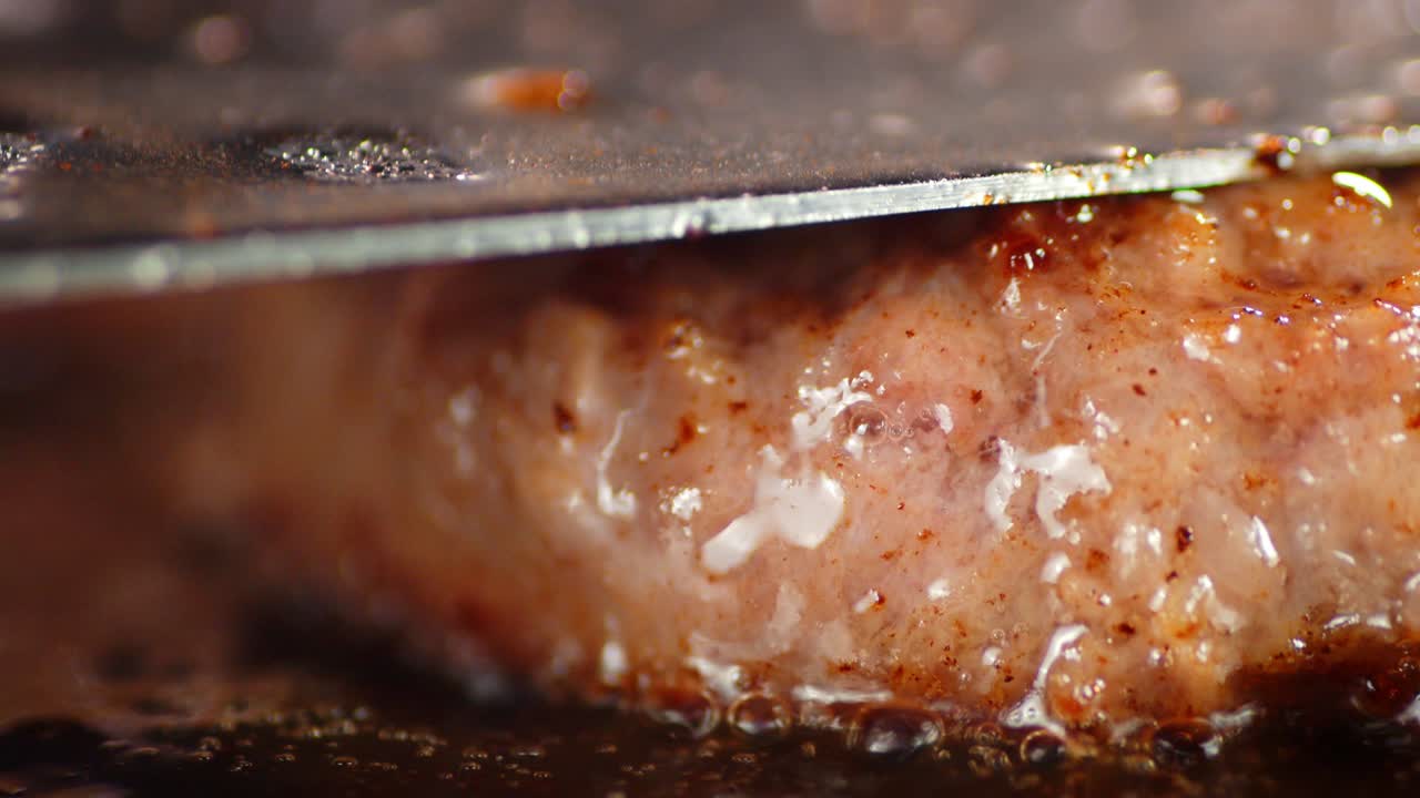 Fried burger meat is fried in hot oil.