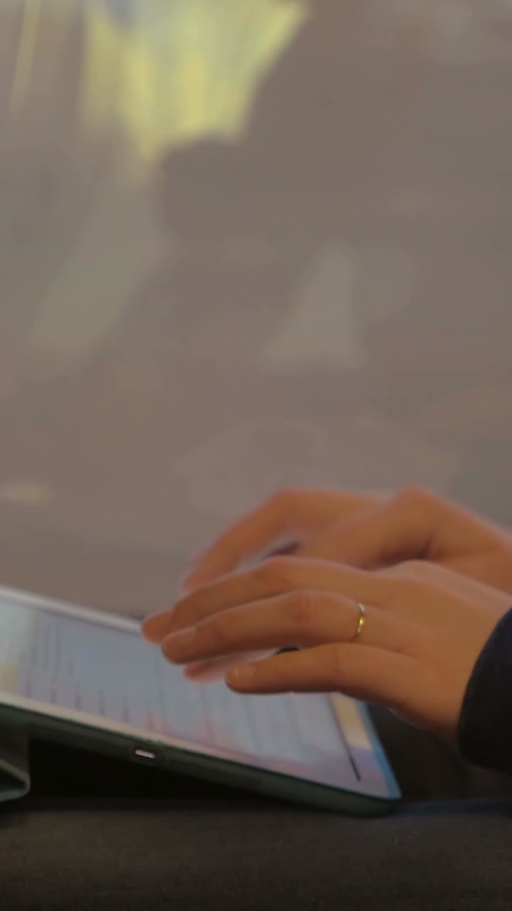 Hands Using a Tablet