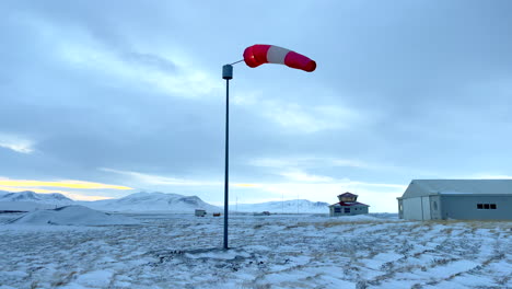 wind sock slowly moving on blönduos airfield in iceland on a cold cloudy winter day