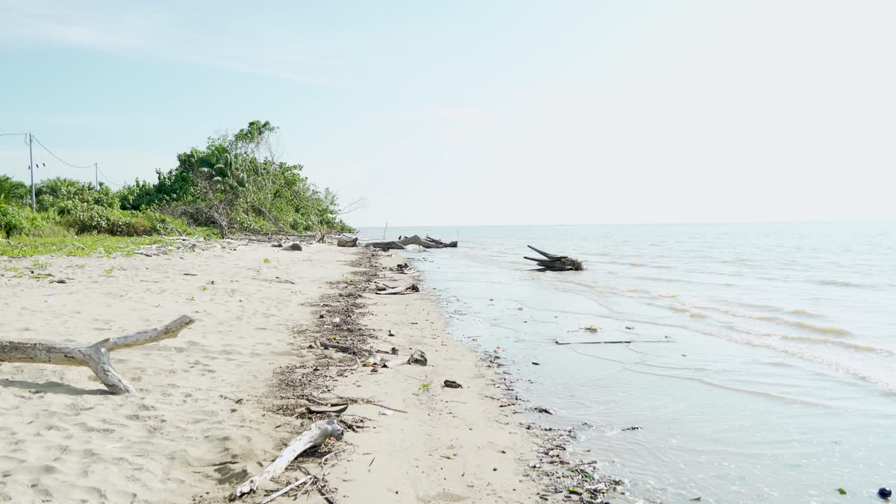 Summer View Of Alit Beach And Fishing Village Kabong,White Sandy Beach,Blue Sea ,Sky And Green Coconut Trees,Sarawak,Borneo.