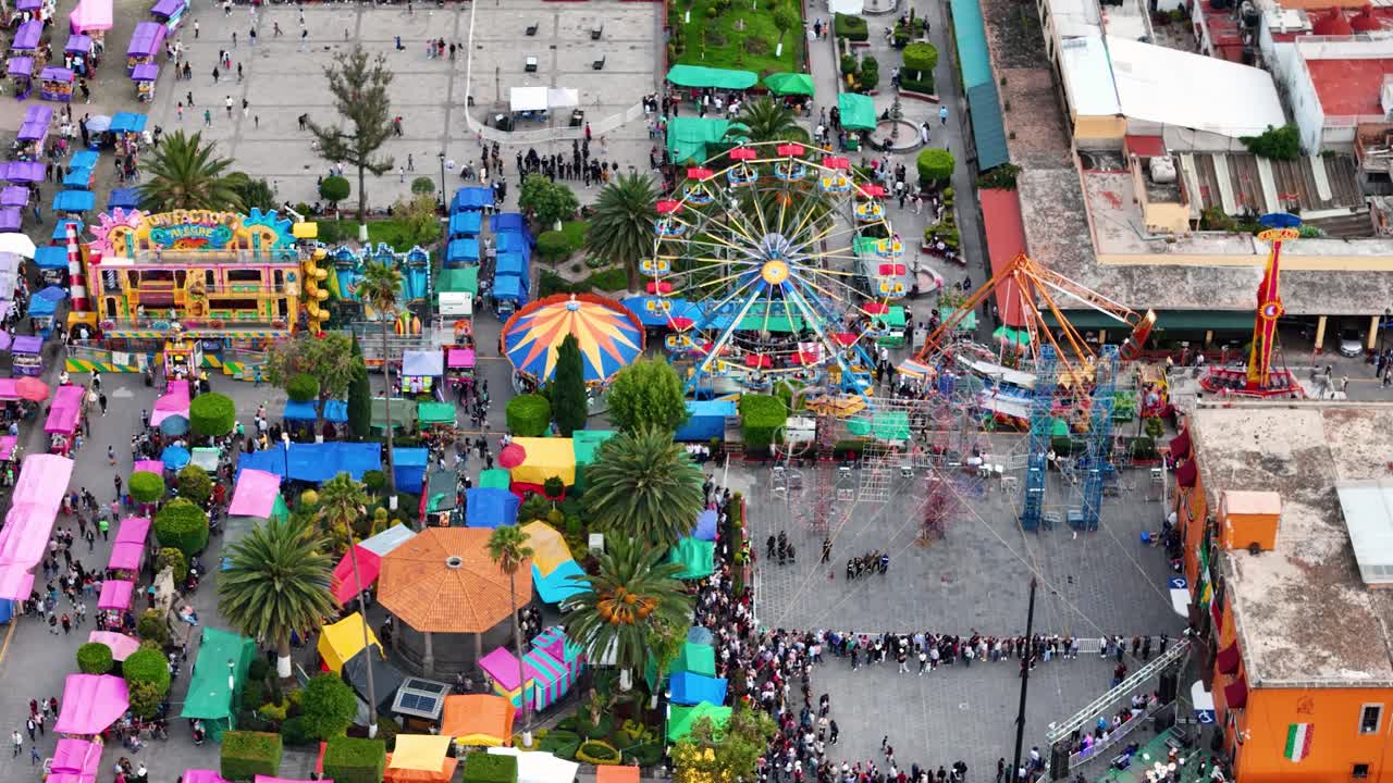 Static aerial shot of the municipal fair and craft market on a Sunday in September in Tepotzotlán, Mexico, during the Mexican Independence Day celebrations