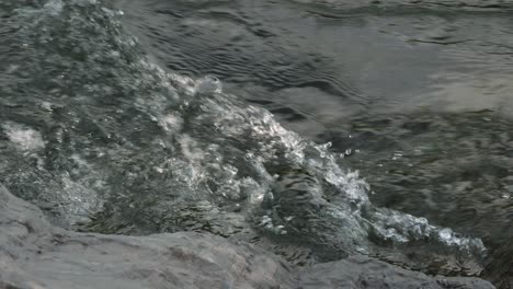 close view of the turbulent waters of the tumut river in tumut in the snowy mountain region of australia, new south wales.