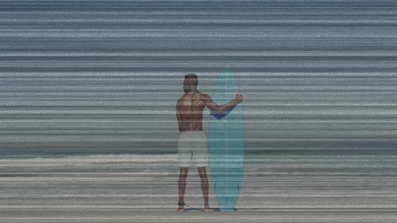 male surfer standing on beach holding surfboard, viewing animated weather technology overlay