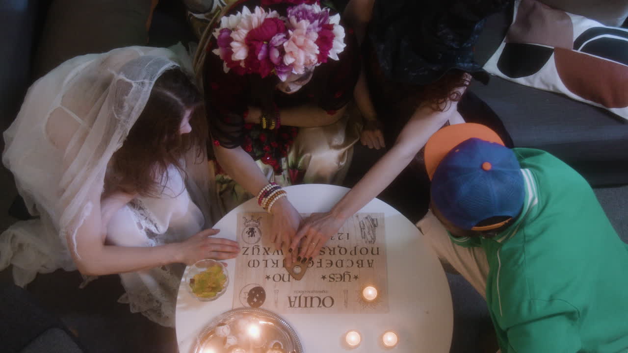 People Playing Ouija Board