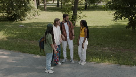 diverse group of friends socializing in a park