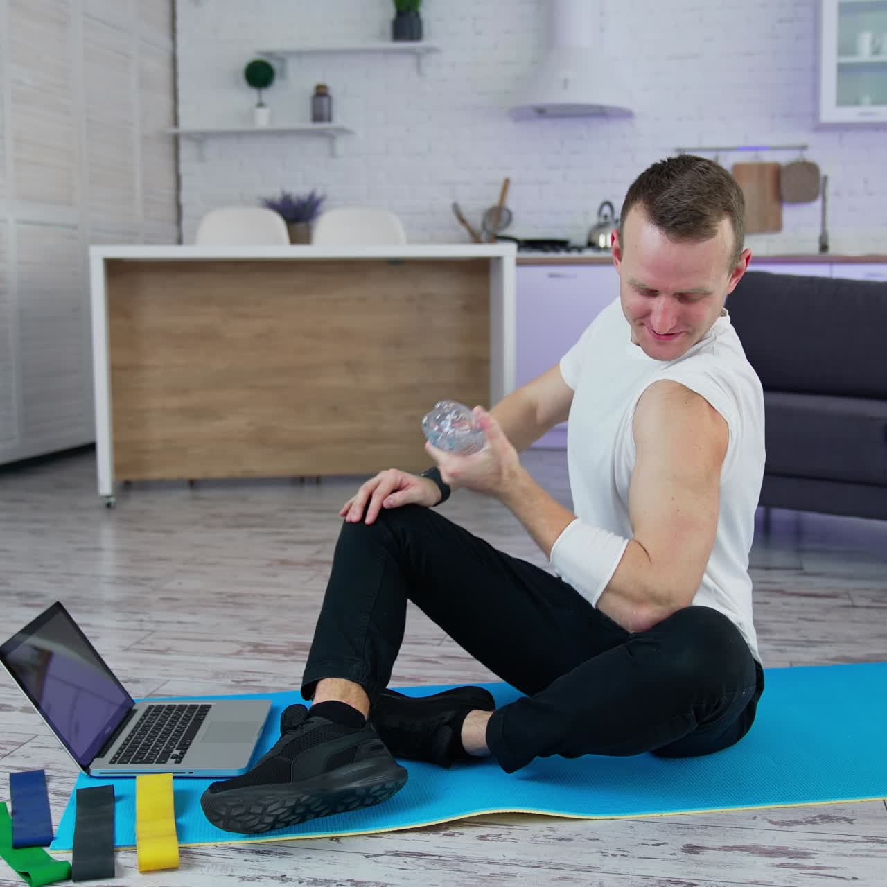 Sporty handsome man doing exercise at home. Quarantine isolation indoor training