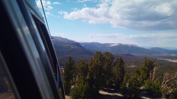 Gimbal static shot from gondola looking forward as it descends down the mountain in Mammoth, California