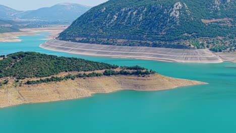 high aerial establishing of galaxidi region with water, hills, forest, and shoreline