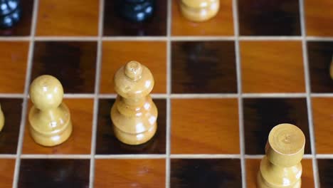 checkmate.wood chessboard and wooden chess pieces. chess game