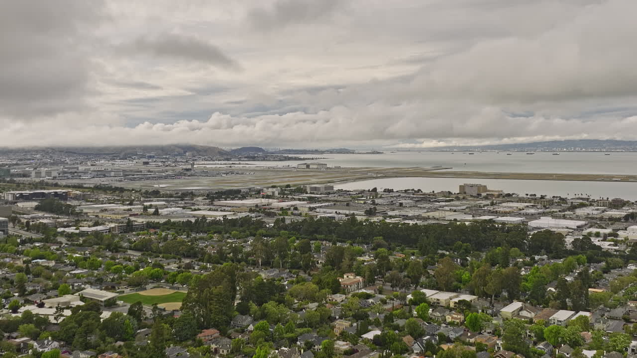 burlingame california aerial v2 panoramic panning view capture charming easton addition neighborhood with leafy streets, sfo airport with san francisco bay views - shot with mavic 3 cine - june 2022