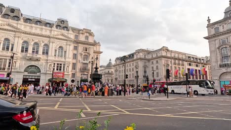 crowds and vehicles in central london street