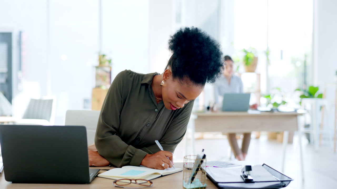 Business woman, laptop and writing on paper
