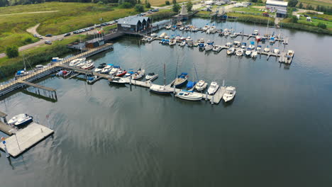 aerial shot of drone flying around marina in blotnik, pomeranian, poland